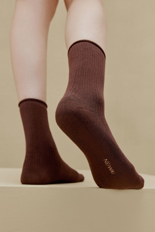 feet in brown socks