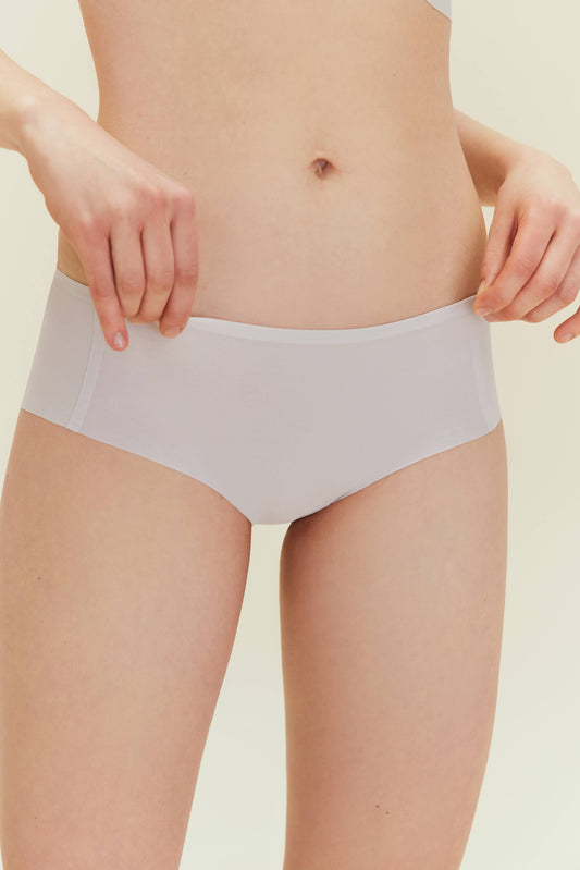 Front view of woman wearing off white underwear