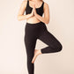 woman with yoga pose wearing a black bra and black leggings