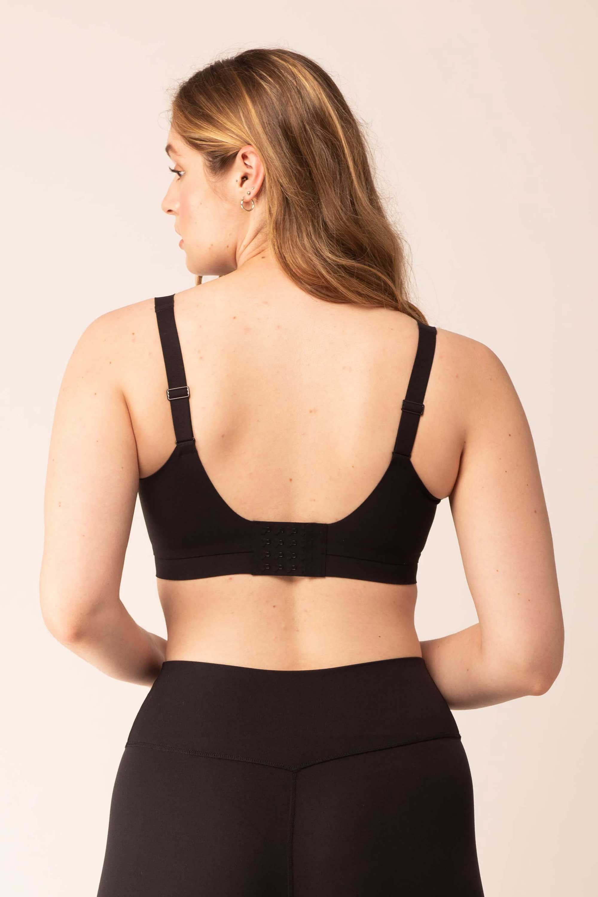 back of woman wearing black bra