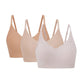 three bras in tan, beige, and light pink