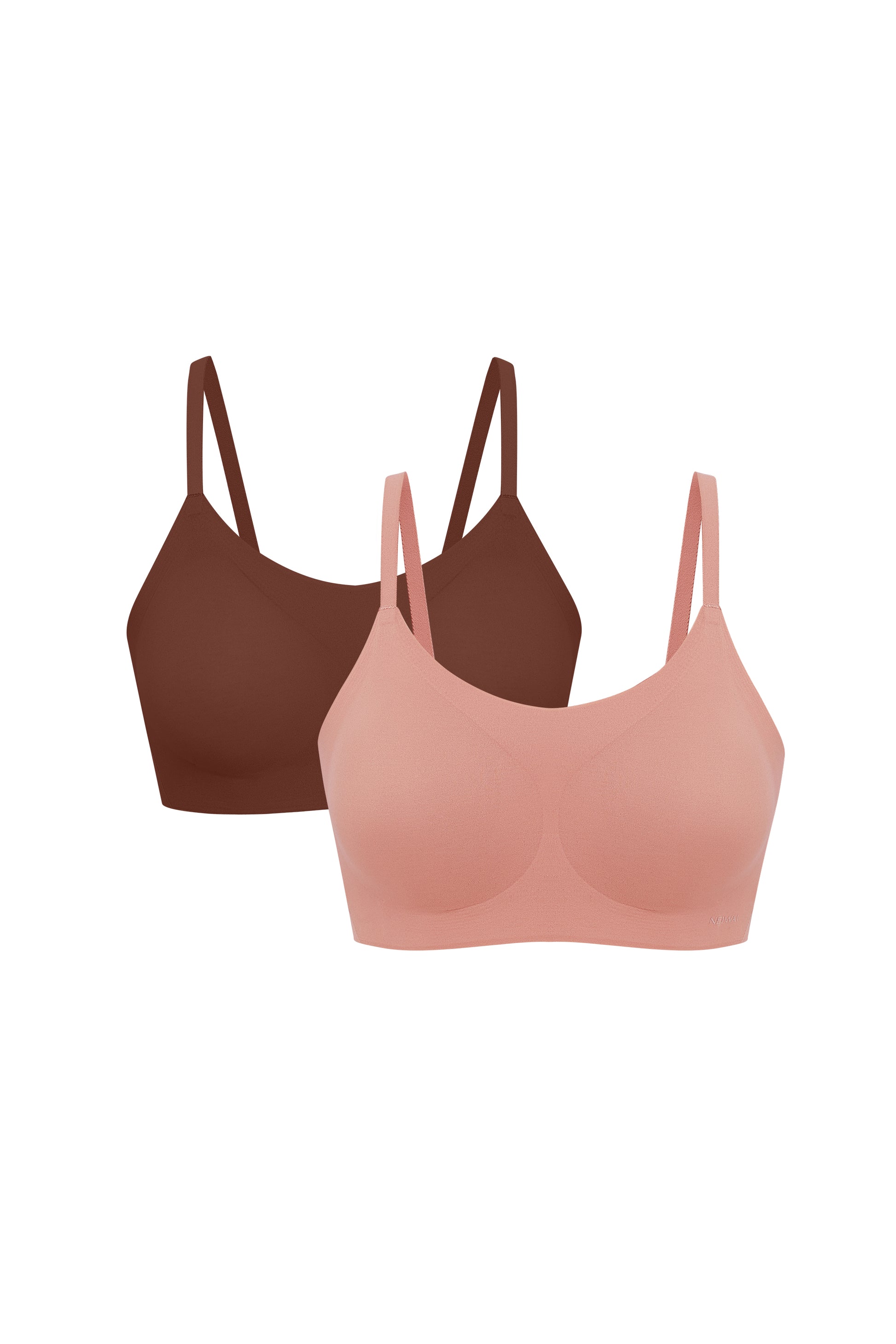 Flat lay image of coral and burgundy spaghetti strap bras