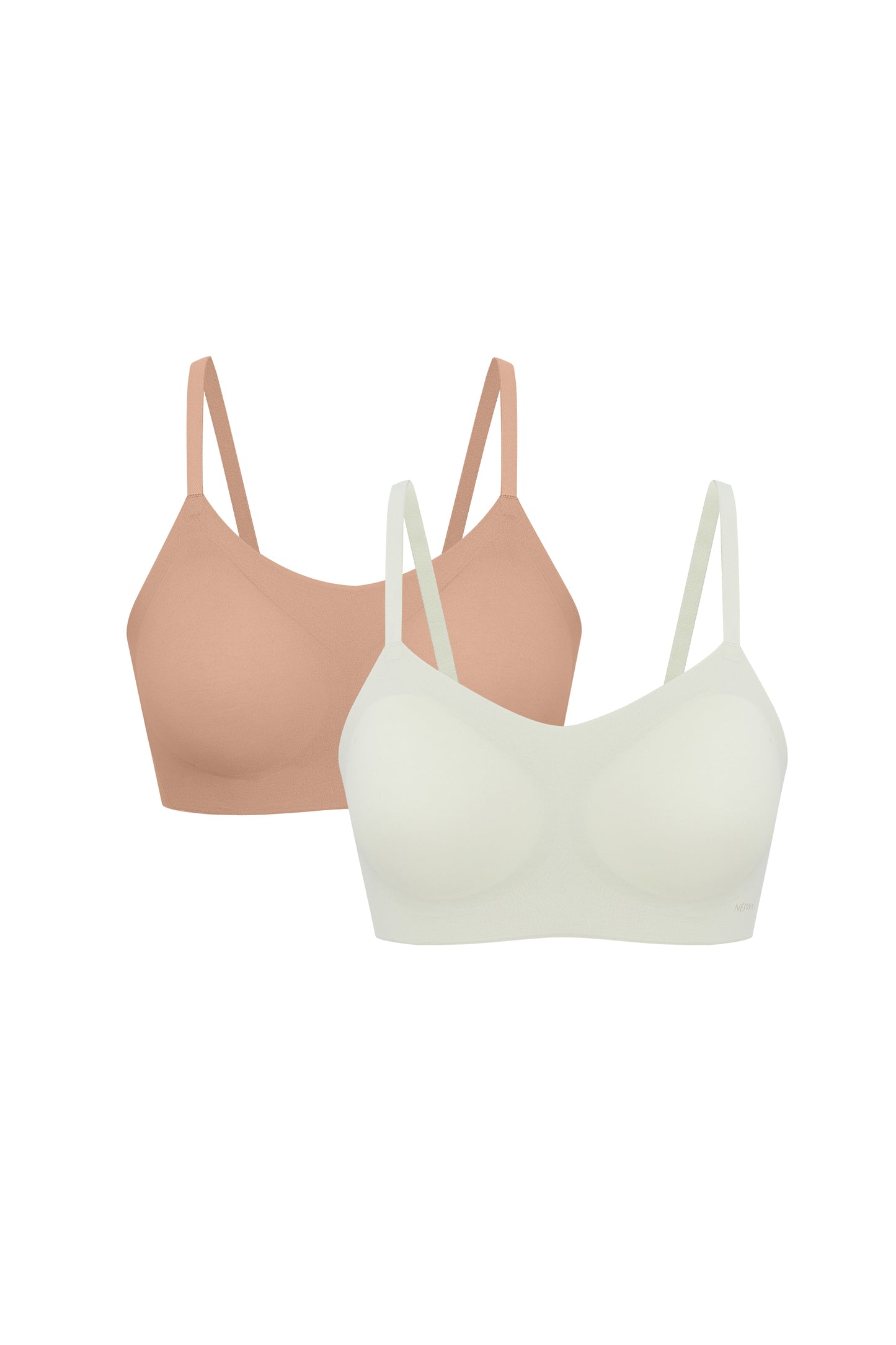Flat lay image of off-white and tan spaghetti strap bras