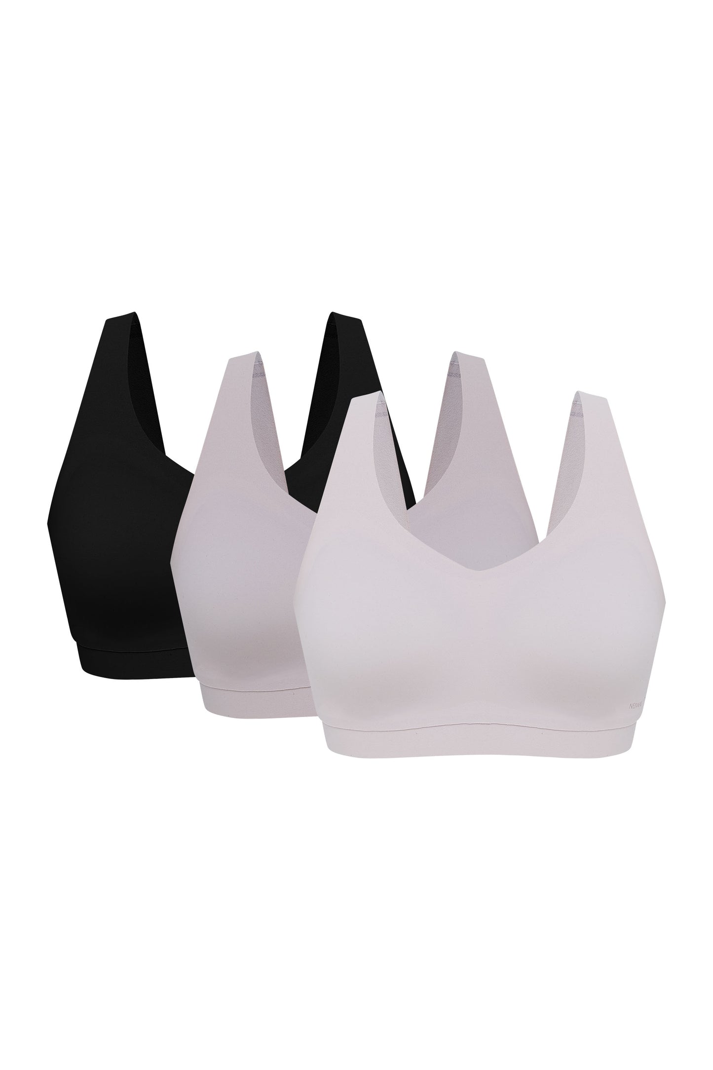 three bras in black, light pink, and off white