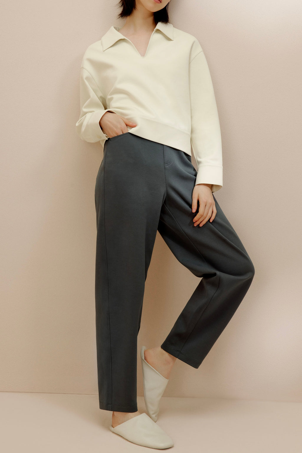 women in the white polo shirt and pants
