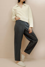 women in the white polo shirt and pants