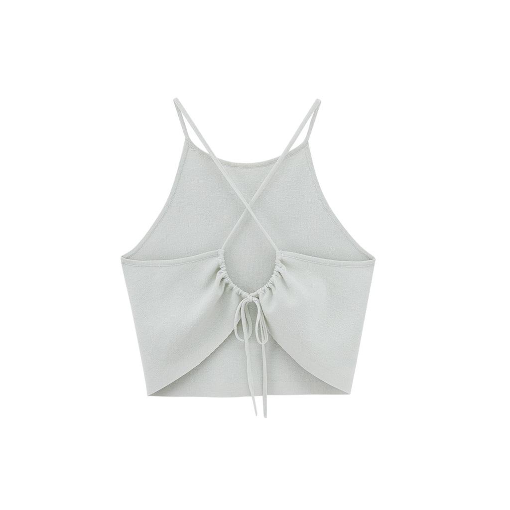 Flat lay image of back of light green tank top