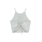 Flat lay image of back of light green tank top