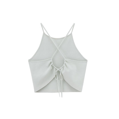 Flat lay image of back of light green tank top