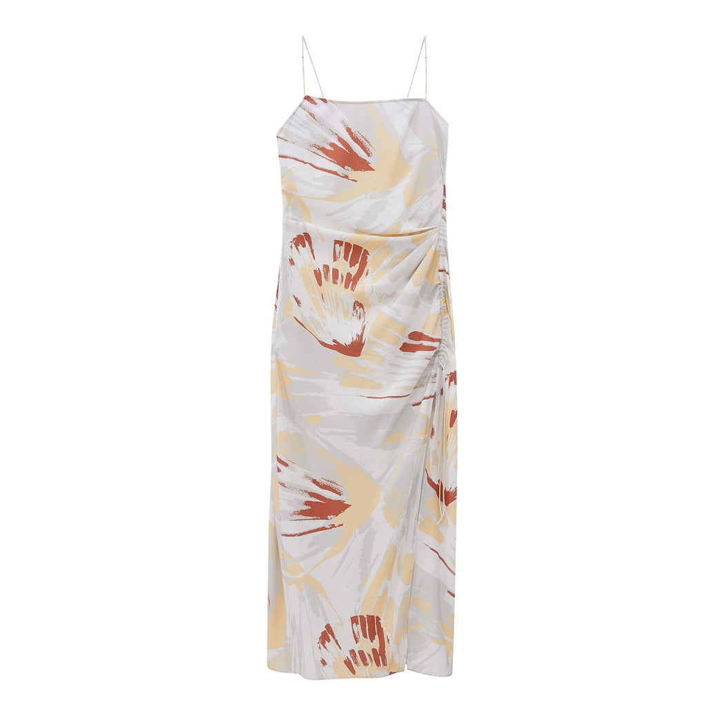 Flat lay of spaghetti strap dress with brown, beige, and white print