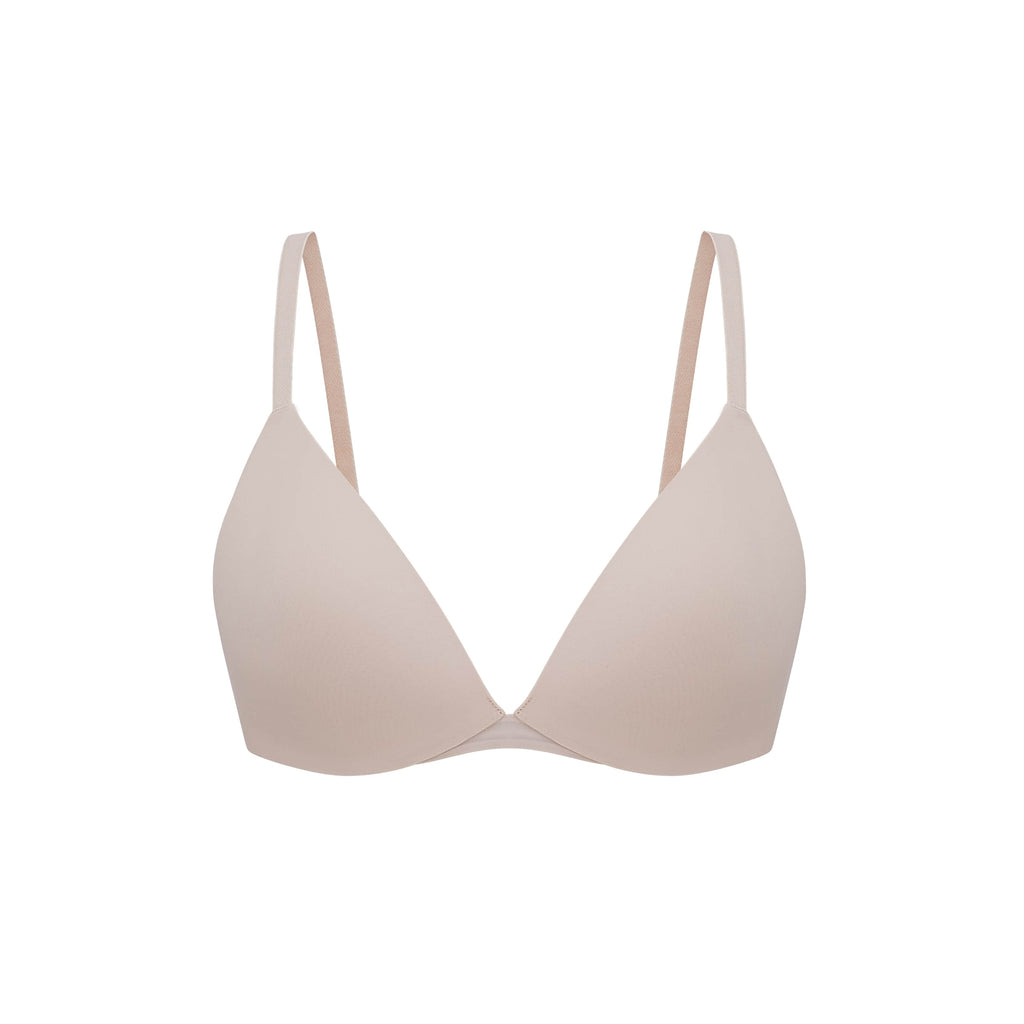 Flat lay of light pink bra.
