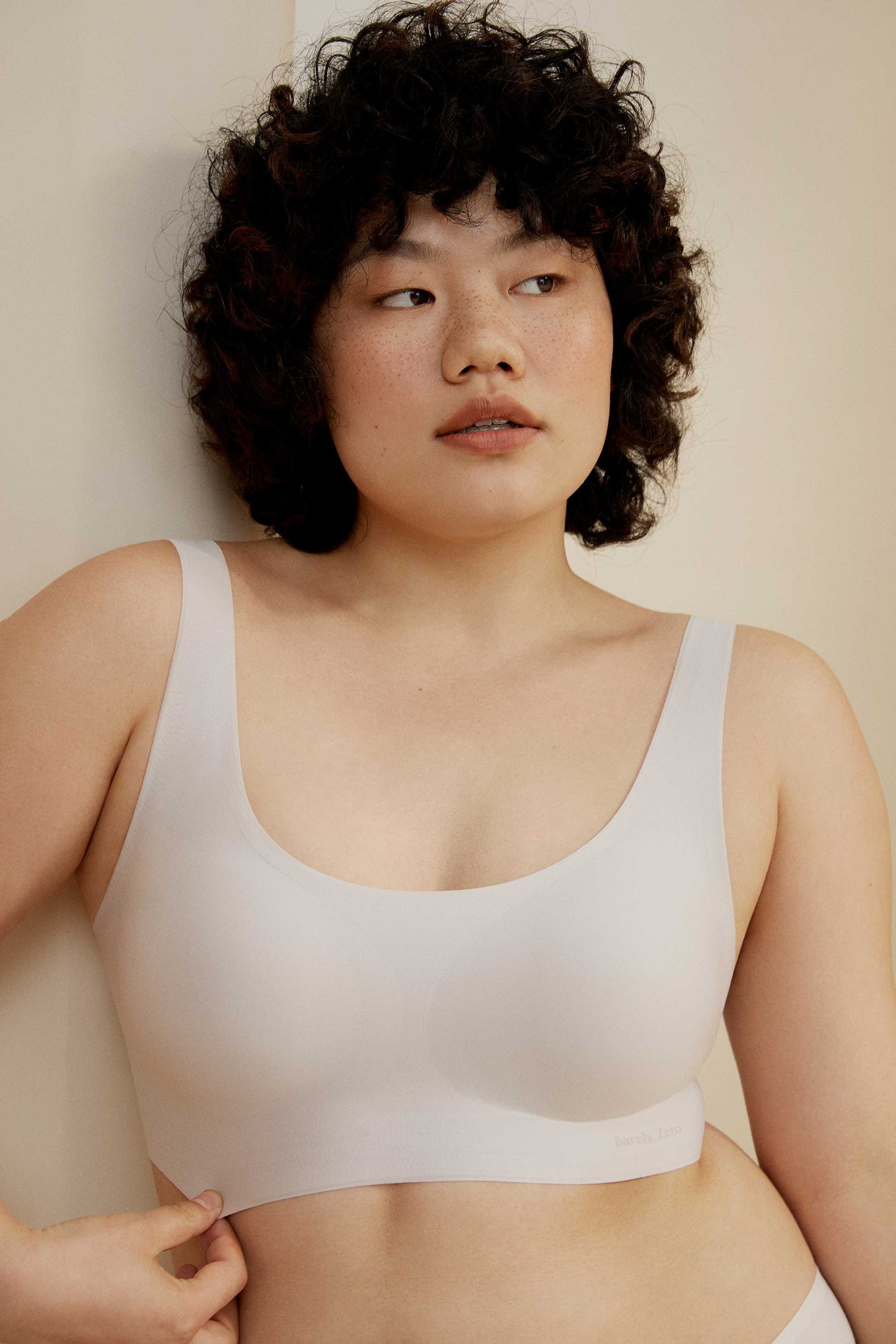 Woman wearing offwhite bra