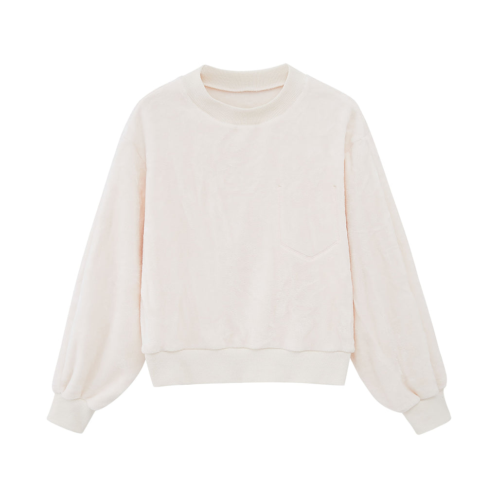a white fleece pull over top