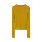 Flat lay of golden yellow sweater