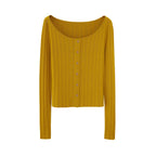 Flat lay of golden yellow sweater