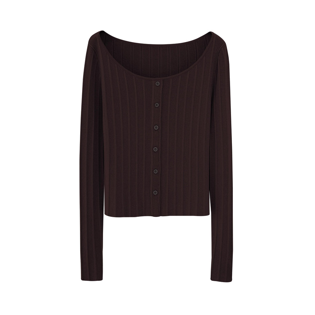 Flat lay of brown sweater