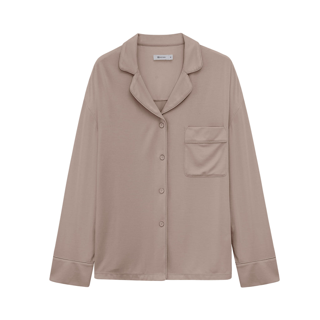 Flat lay image of tan button up pajama shirt with pocket