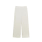 Flat lay image of off-white pajama pant with two decorative buttons at waist band