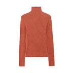 flat lay of orange turtleneck sweater