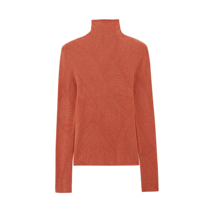 flat lay of orange turtleneck sweater
