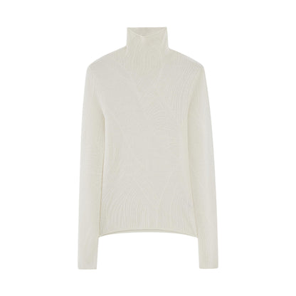 flat lay of white turtleneck sweater