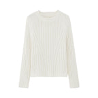 flat lay of white ribbed sweater