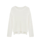 flat lay of white sweater