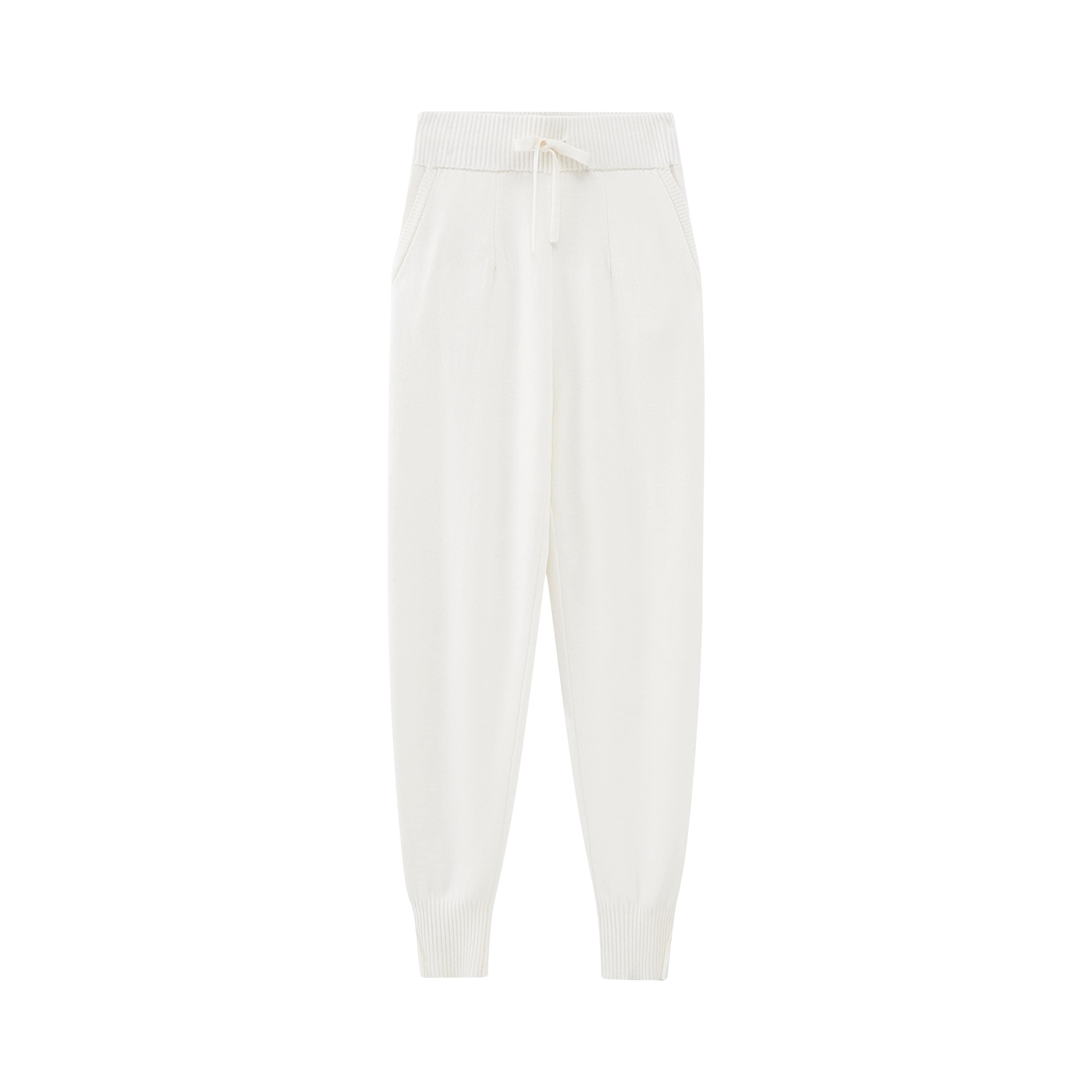 flat lay of white knitted joggers