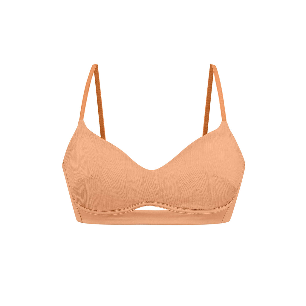flat lay of orange bra