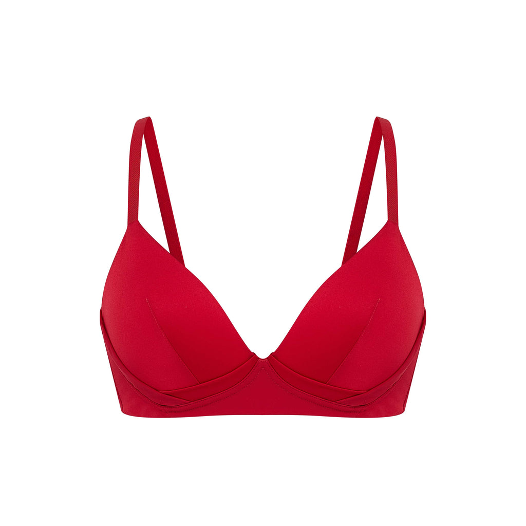 Flat lay of red silk bra