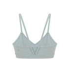 Flat lay of inside of aqua sports bra