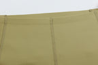 Closeup of waistband of light green leggings