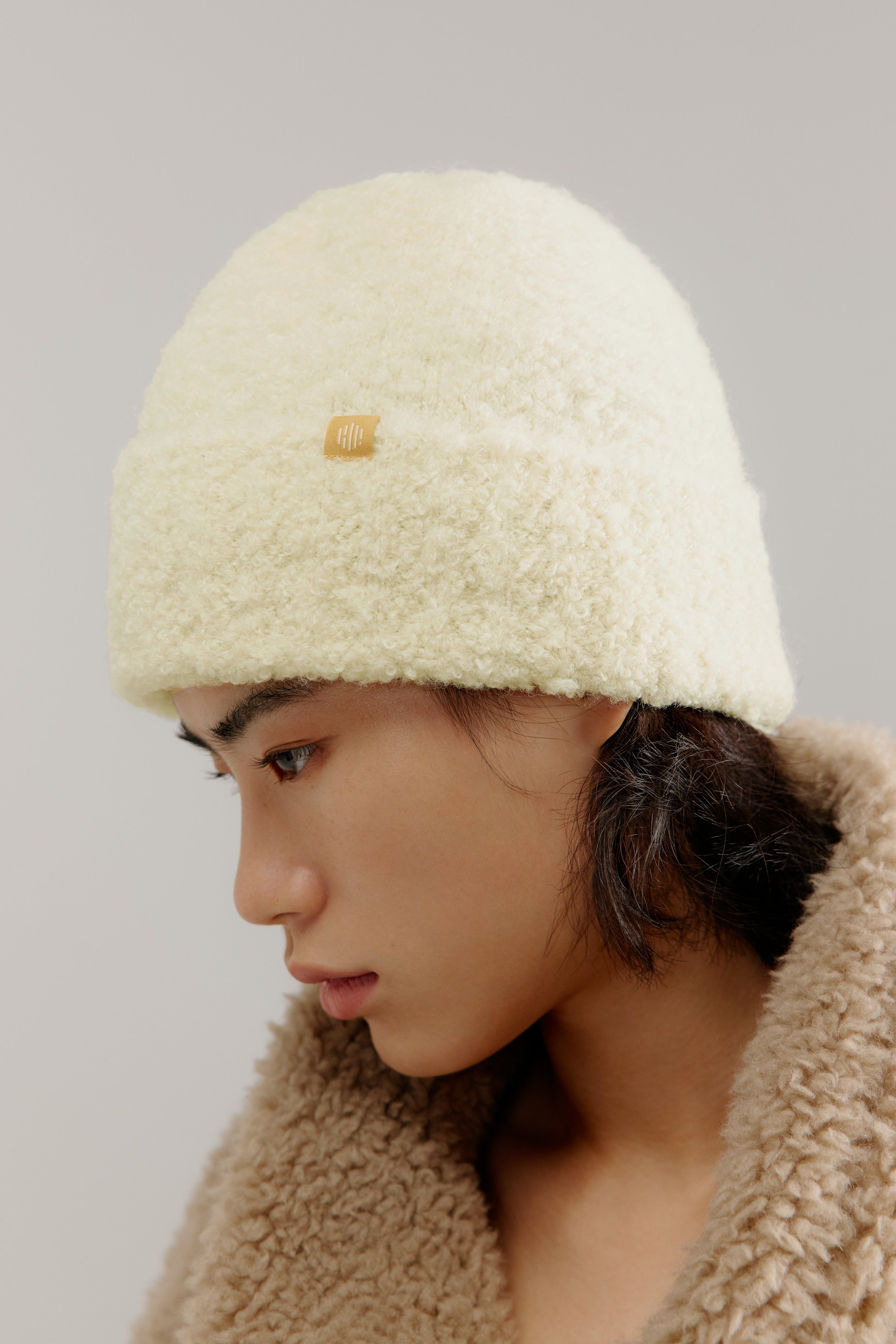 woman wearing a white beanie