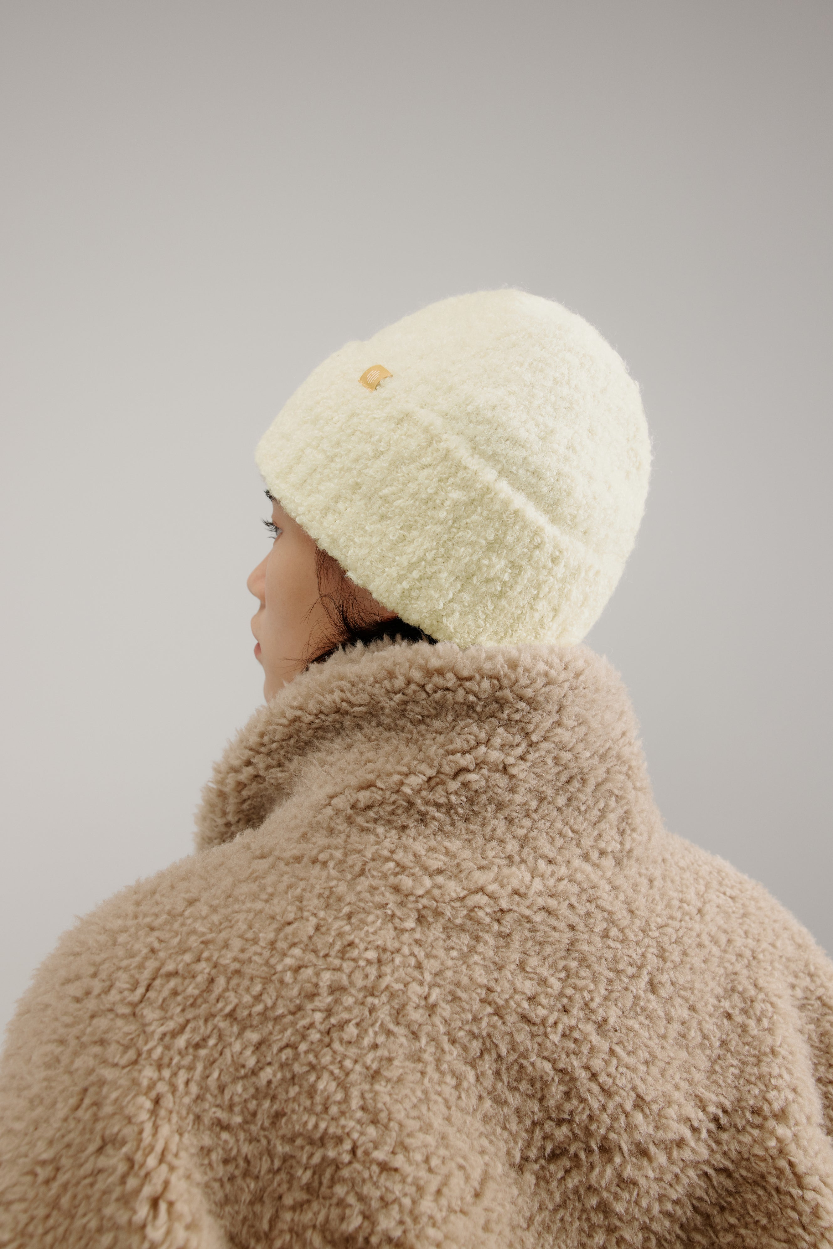 woman wearing a white beanie