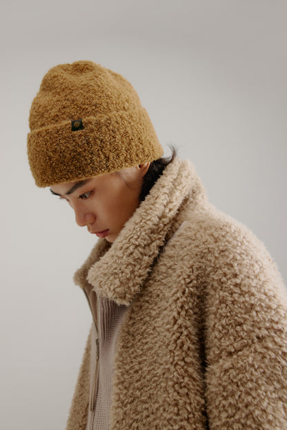 woman wearing a brown beanie