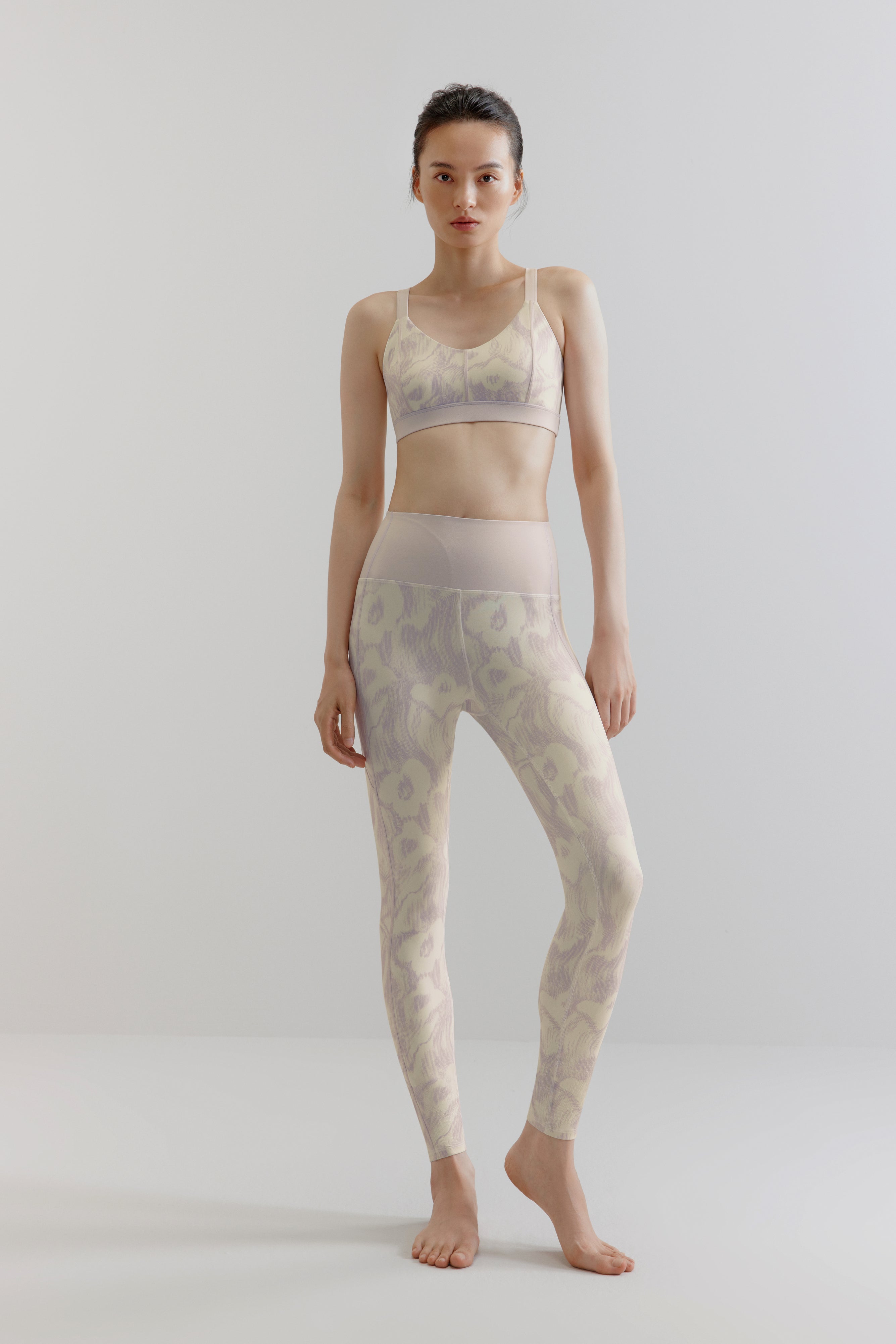 woman in flower print sports bra and leggings