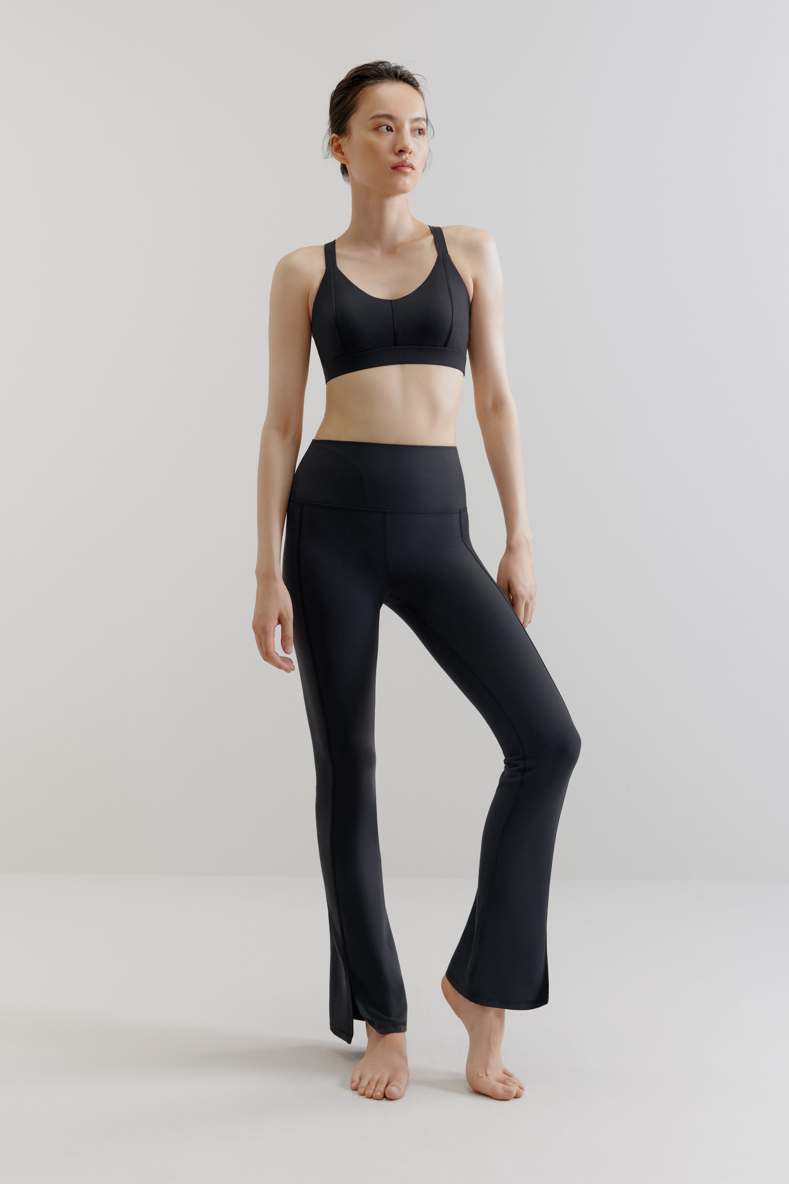woman in black sports bra and leggings