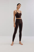 woman in brown sports bra and leggings