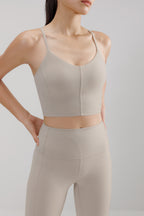 woman in grey sports bra and leggings