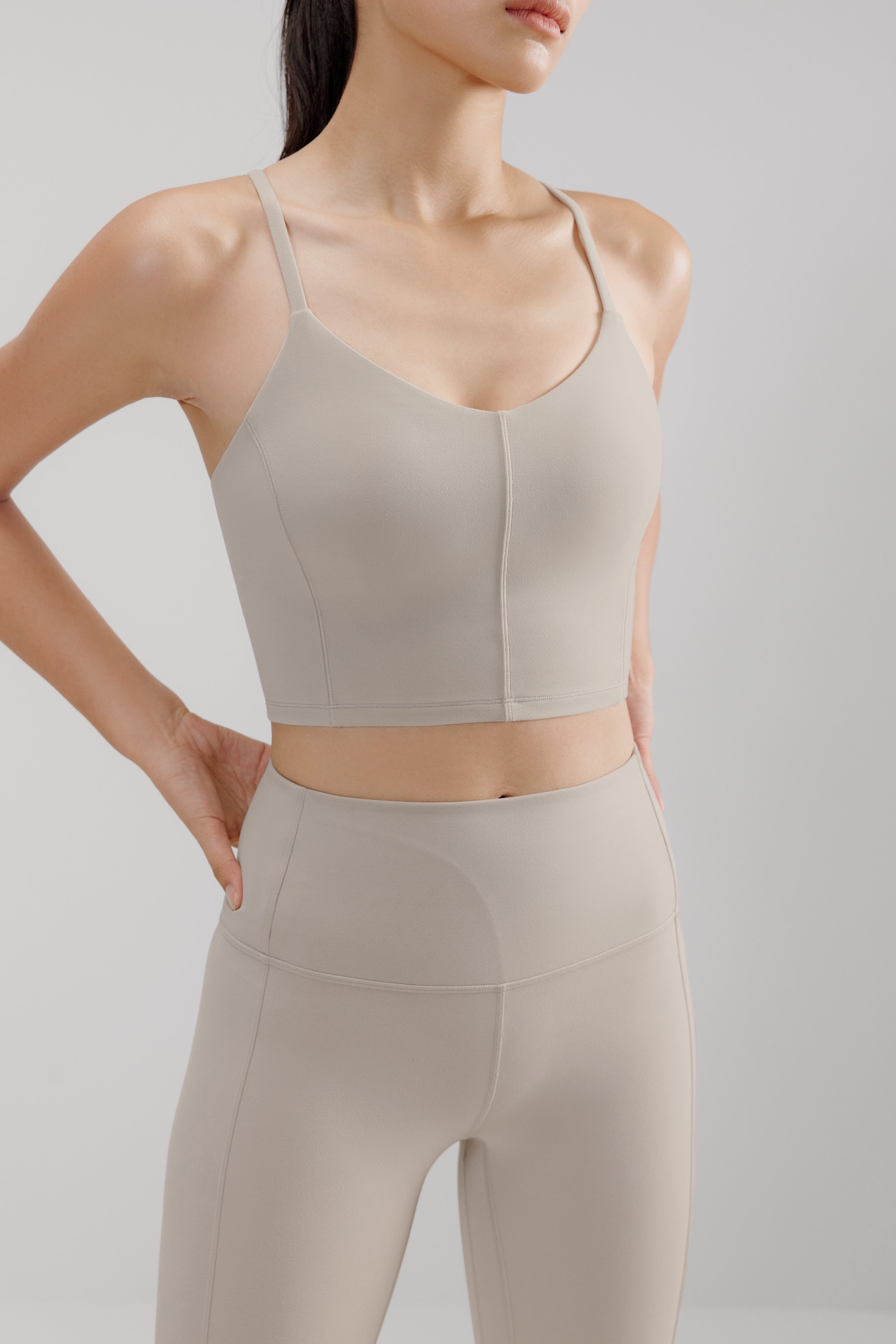 woman in grey sports bra and leggings