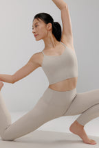 woman in grey sports bra and leggings