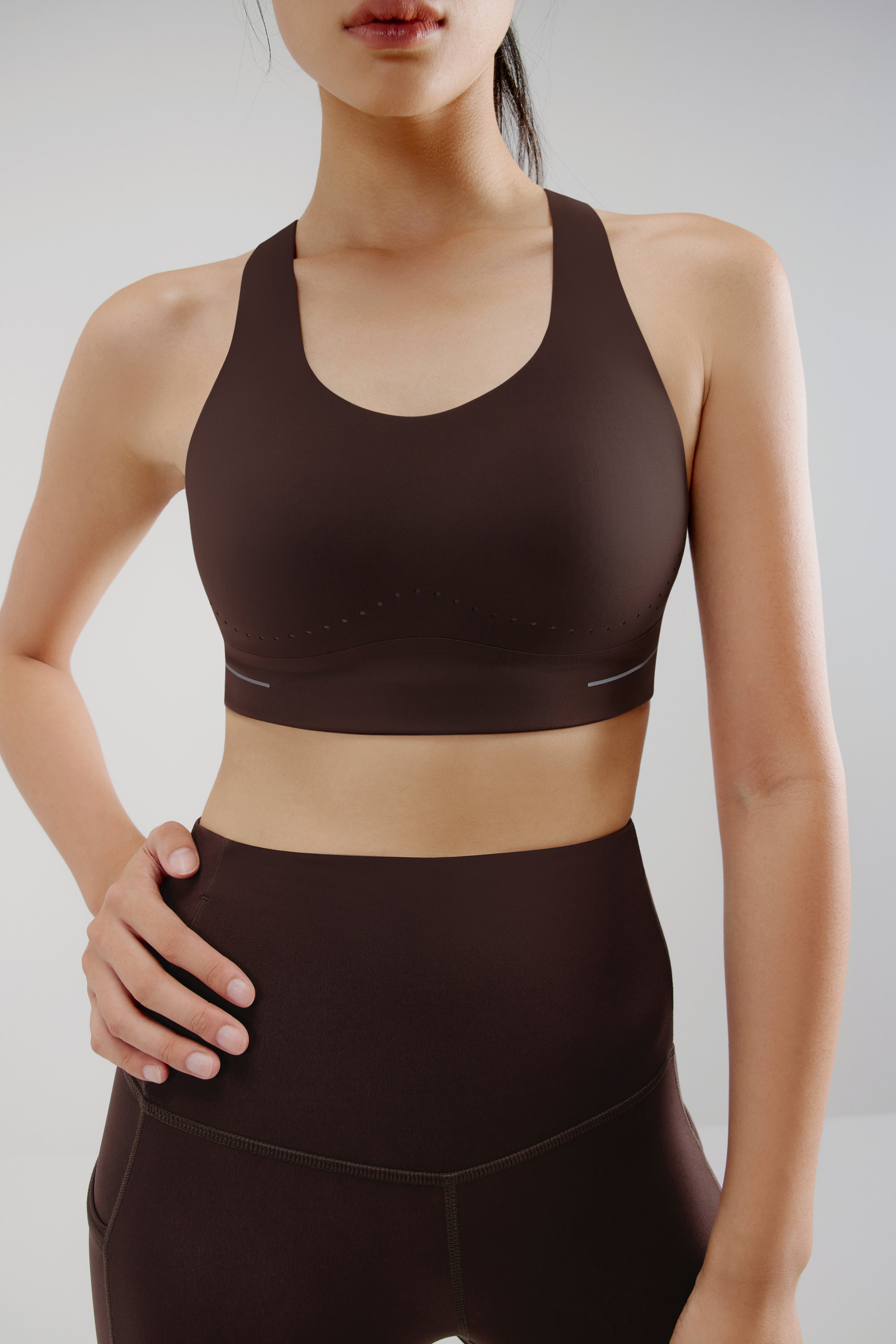 woman in brown sports bra and leggings