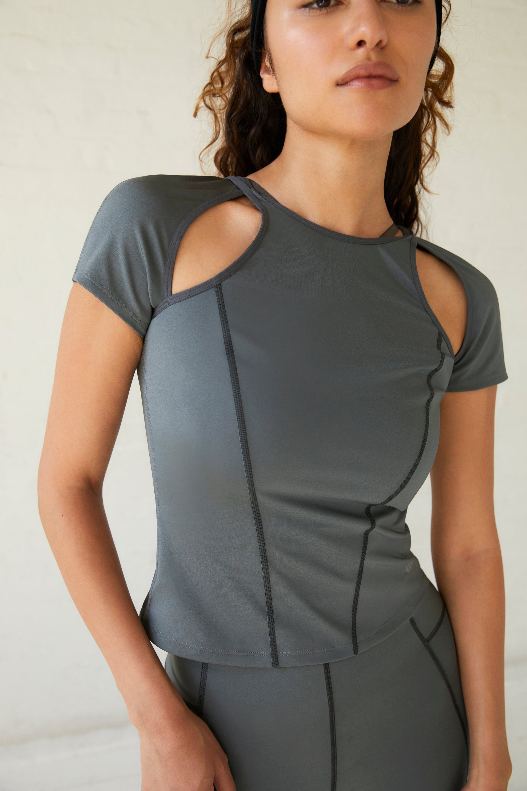 a woman wearing a dark grey t shirt