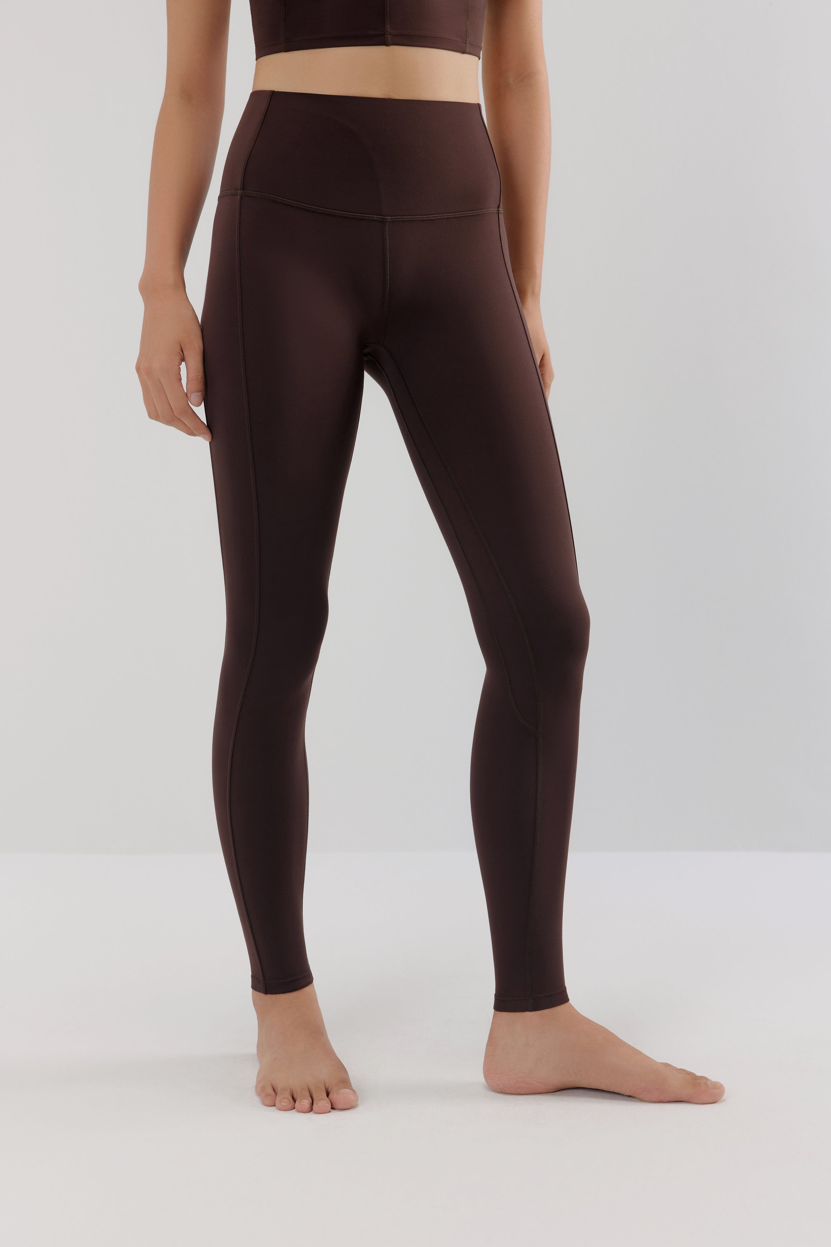 woman in brown leggings