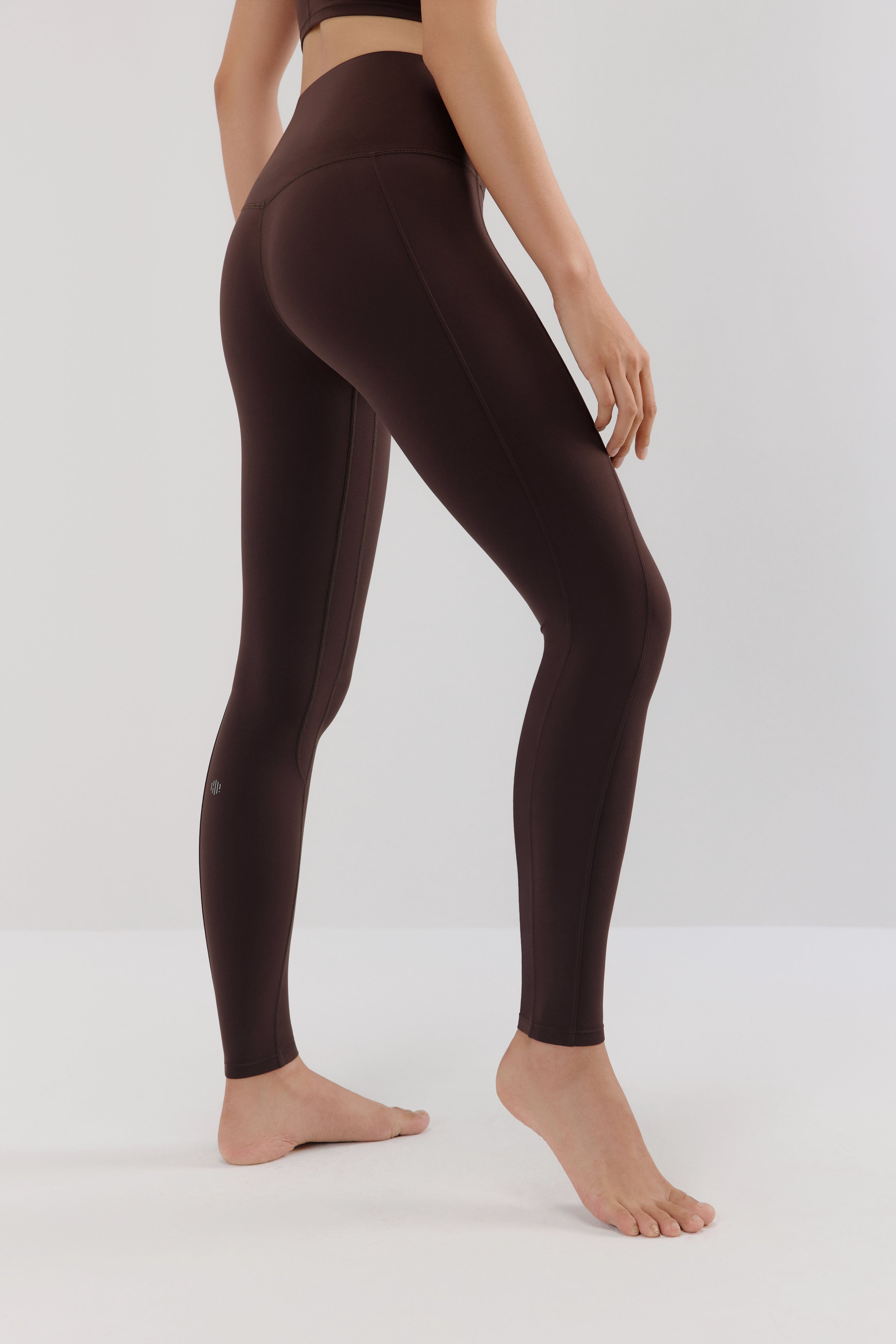 woman in brown leggings