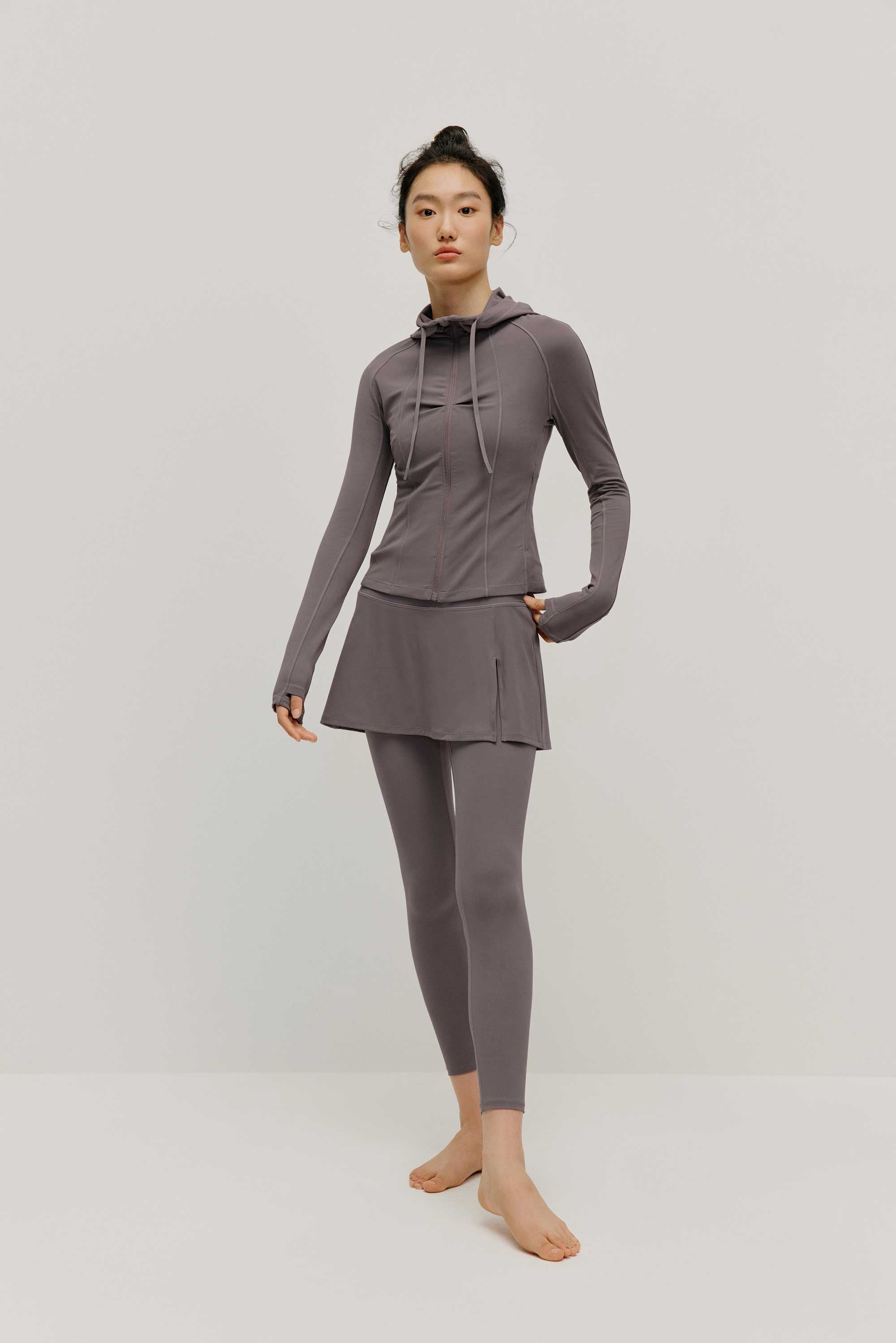 woman in grey hoodie