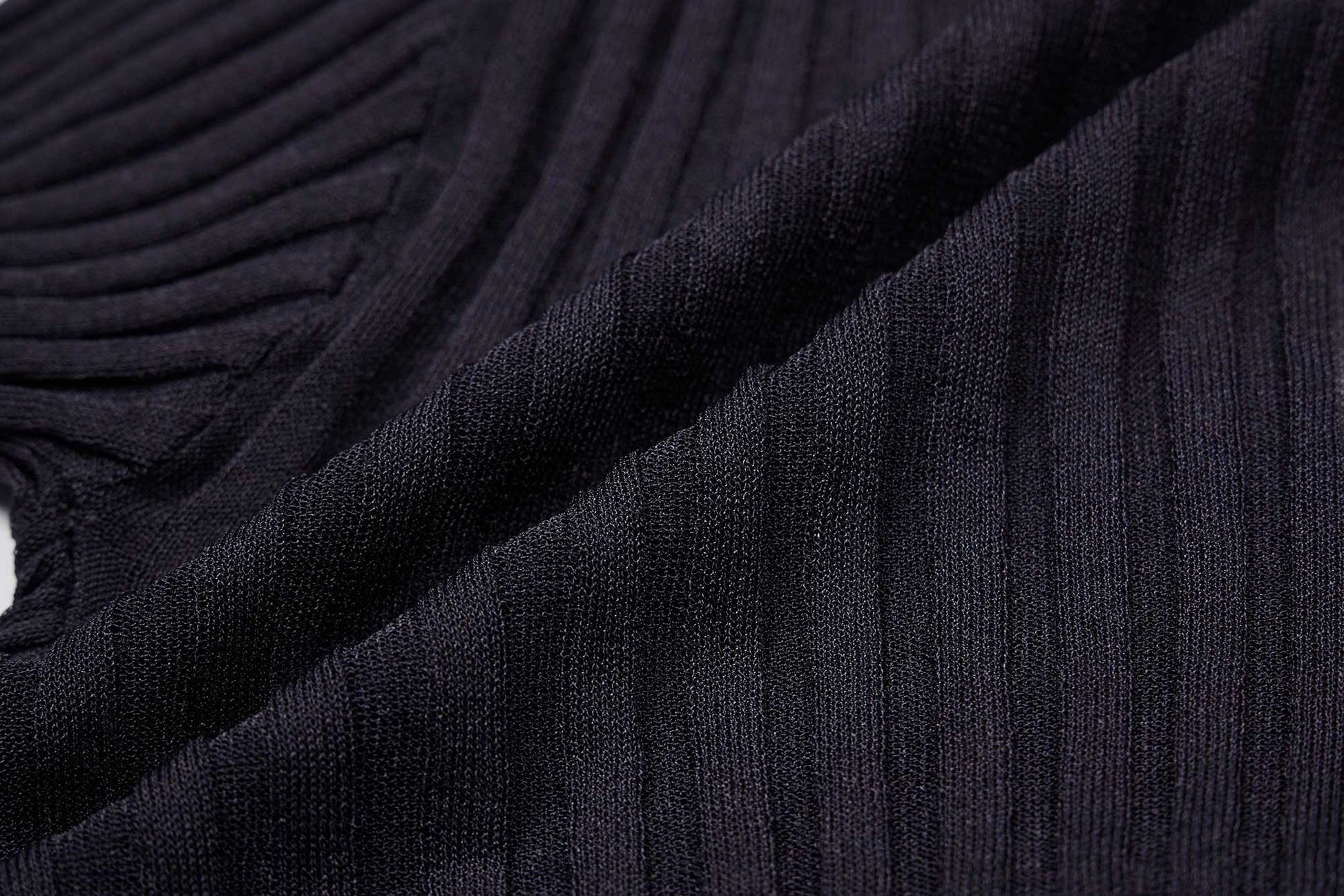 a close up of the ribbed textured knitwear fabric