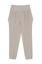 The flat lay image of a pair of light grey tapered joggers