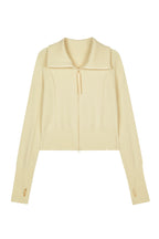 cream cardigan