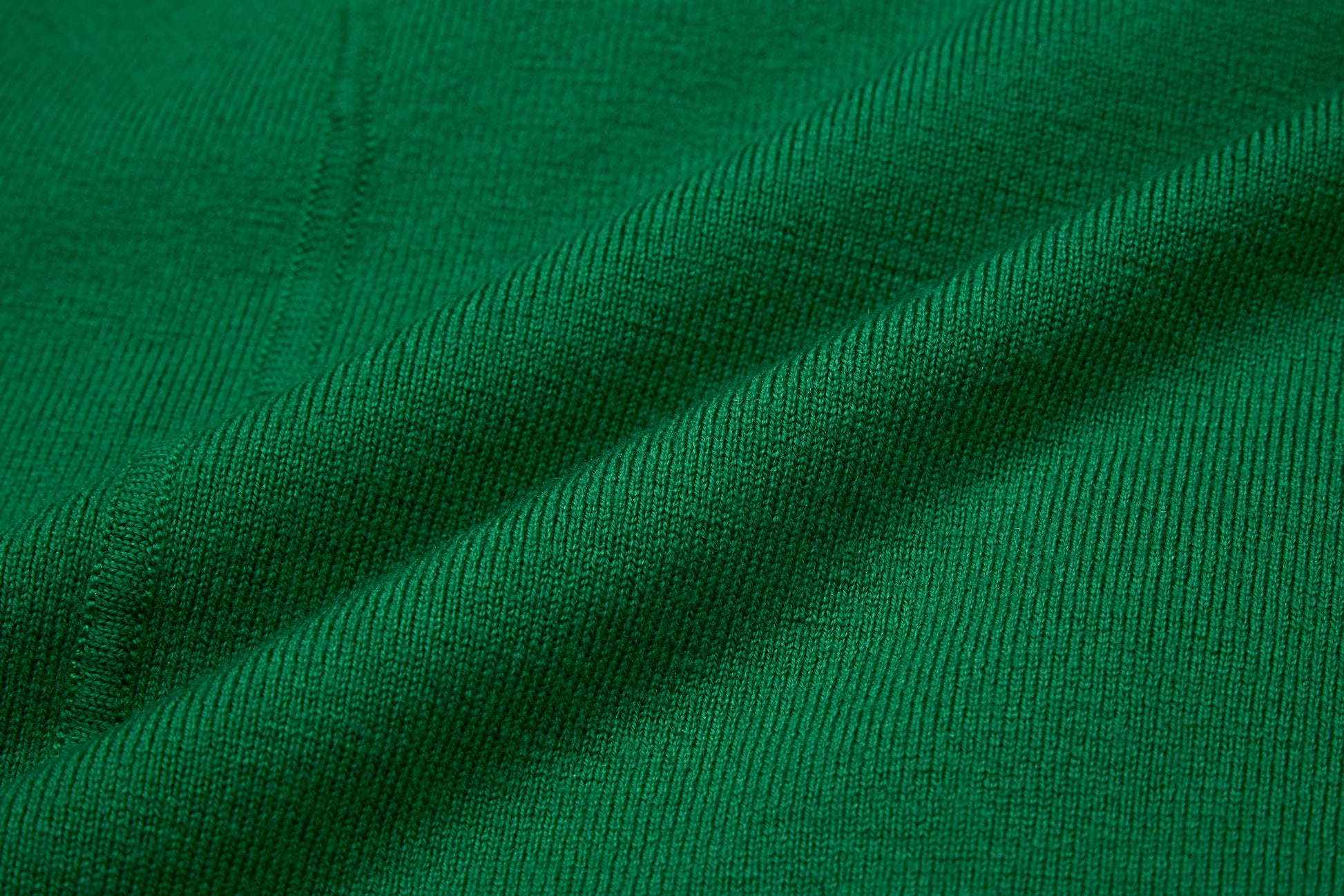 fabric detail of green cardigan